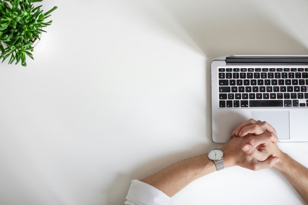 Man at his laptop contemplating the uses of torrenting